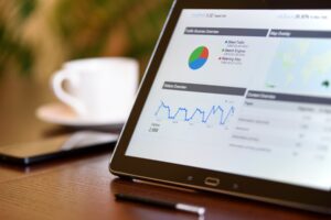 Tablet showing website analytics charts used to build a remarketing audience