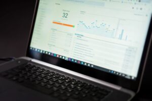 Analytics dashboard on a laptop showing landing page traffic and conversions