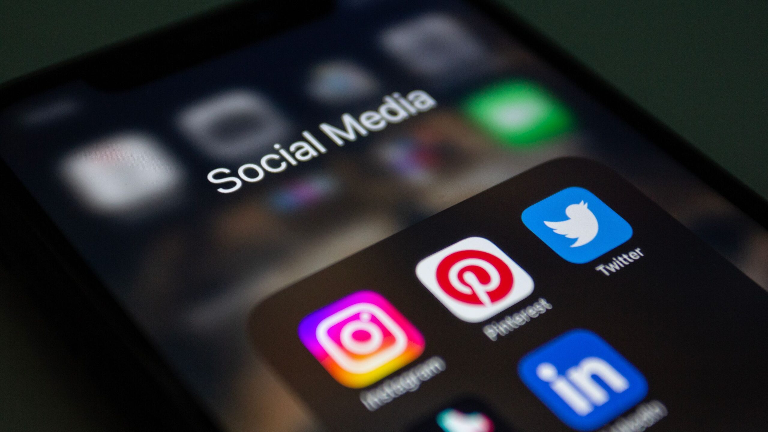 Smartphone showing social media apps used to run HVAC Facebook and Instagram ads