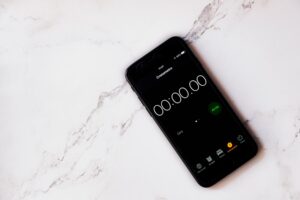 Stopwatch running on a smartphone, the load time a homeowner waits through