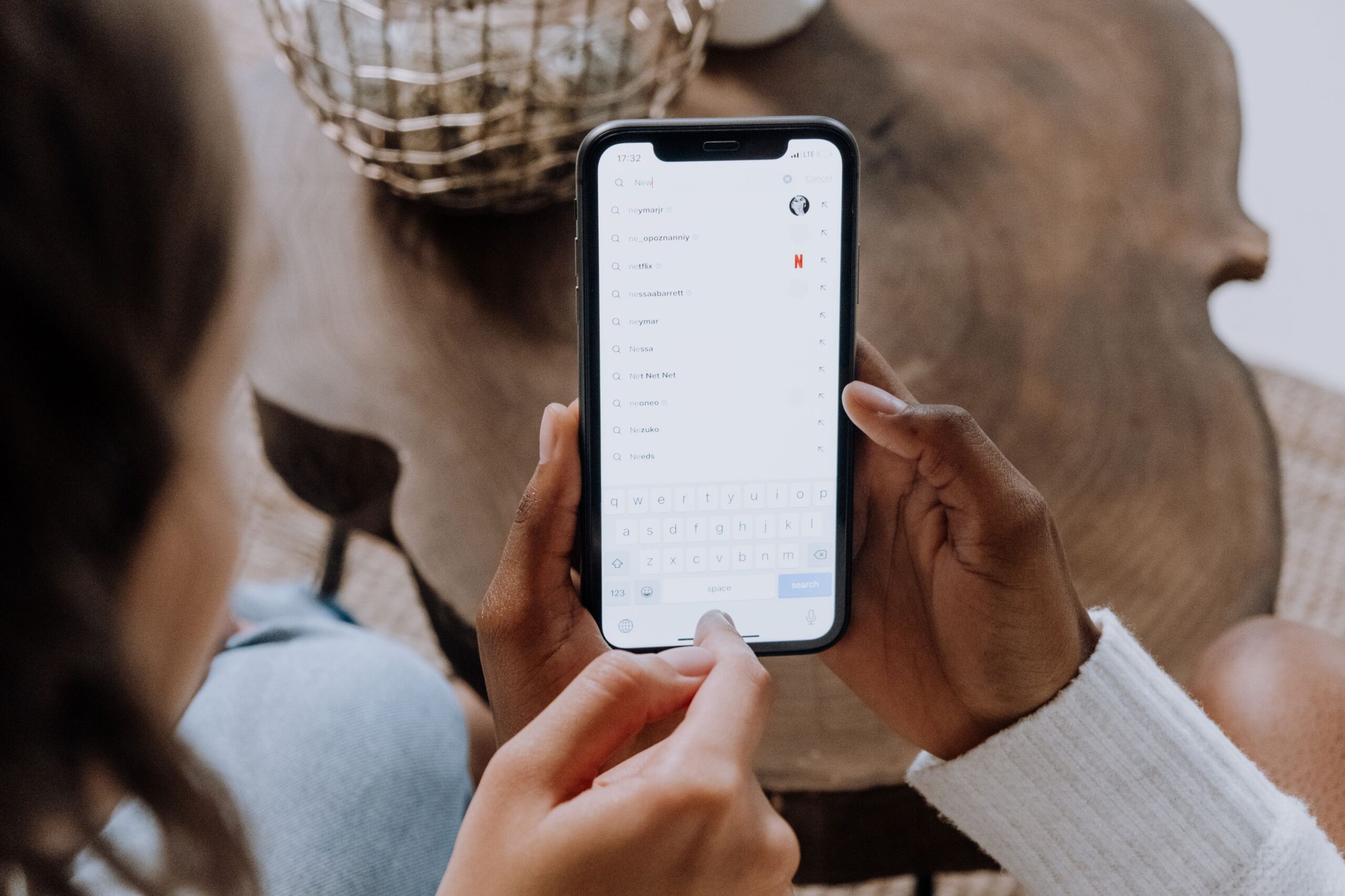 Hands searching on a smartphone, how most HVAC searches actually start