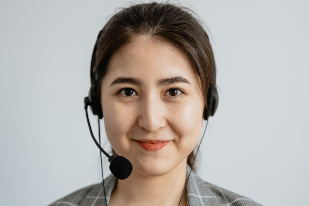 Customer service representative with a headset ready to answer a negative review
