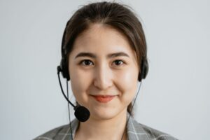 Customer service representative with a headset ready to answer a negative review